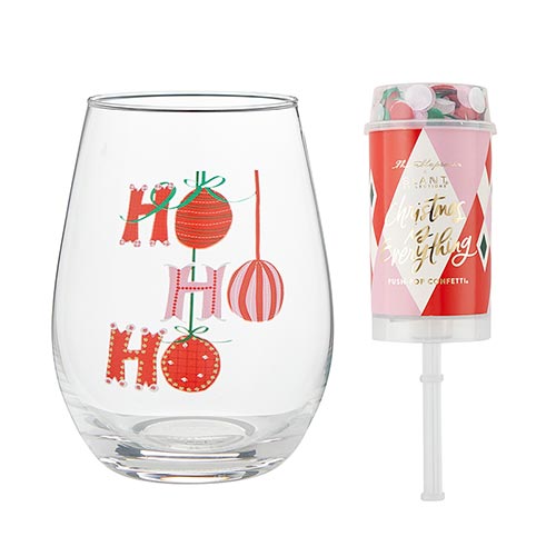 Stemless 20oz wine glass with “Ho Ho Ho” holiday design next to a matching confetti popper.