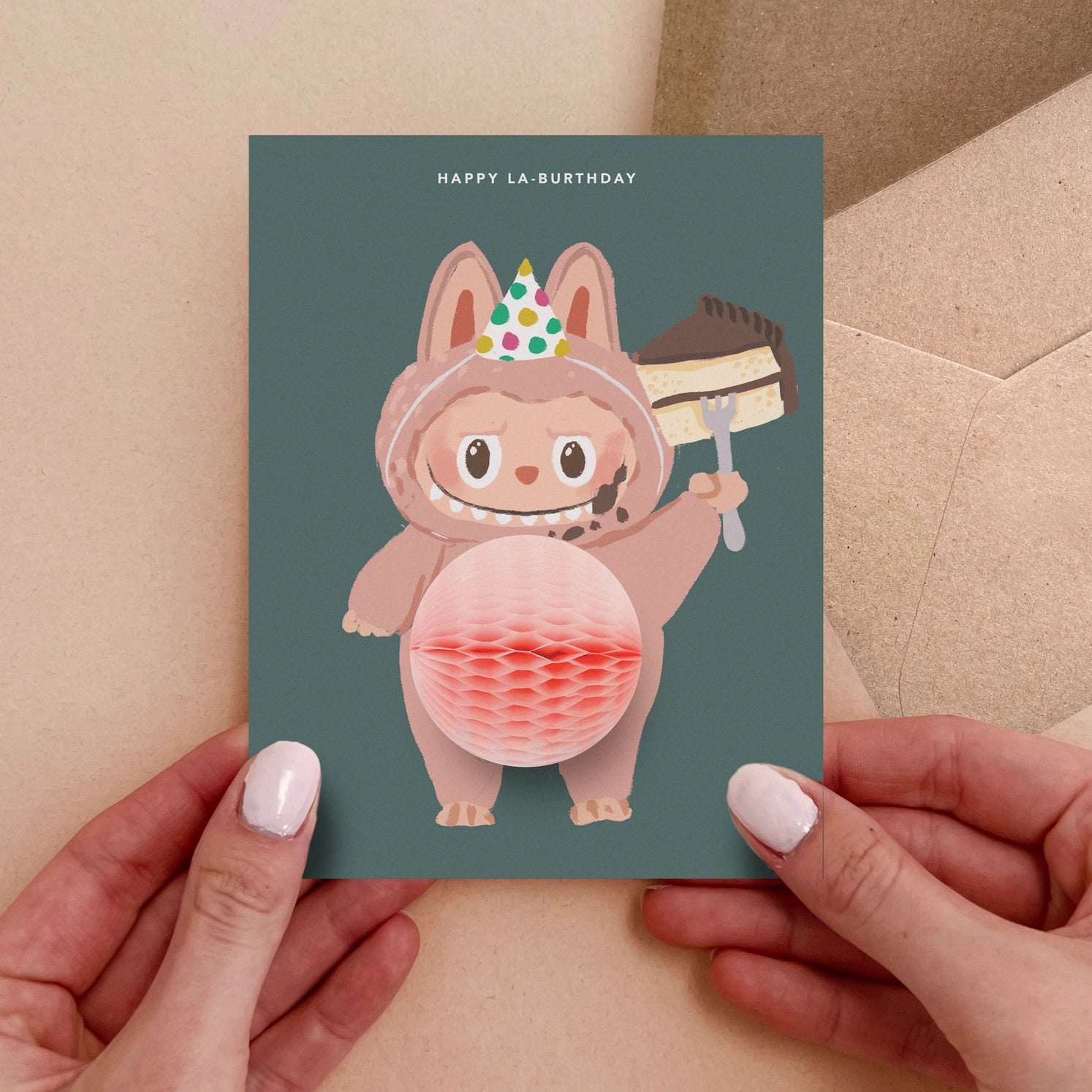 Birthday greeting card featuring cute Labubu monster in party hat holding cake with 3D honeycomb belly pop-up – Funky Confetti
