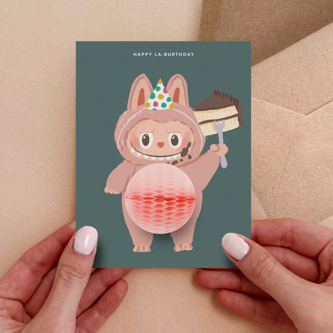 Birthday greeting card featuring cute Labubu monster in party hat holding cake with 3D honeycomb belly pop-up – Funky Confetti