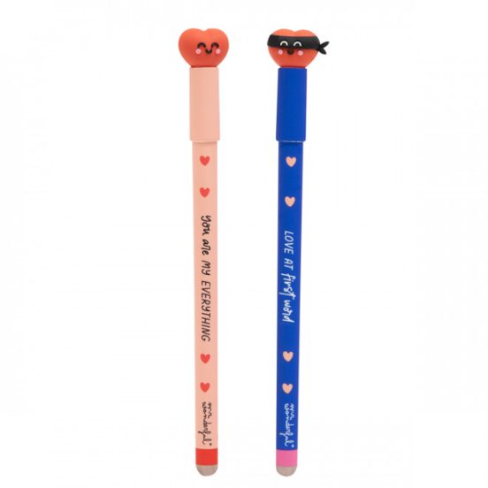 Two erasable pens with heart character caps on—peach “You are my everything” and blue “Love at first word” (masked heart).