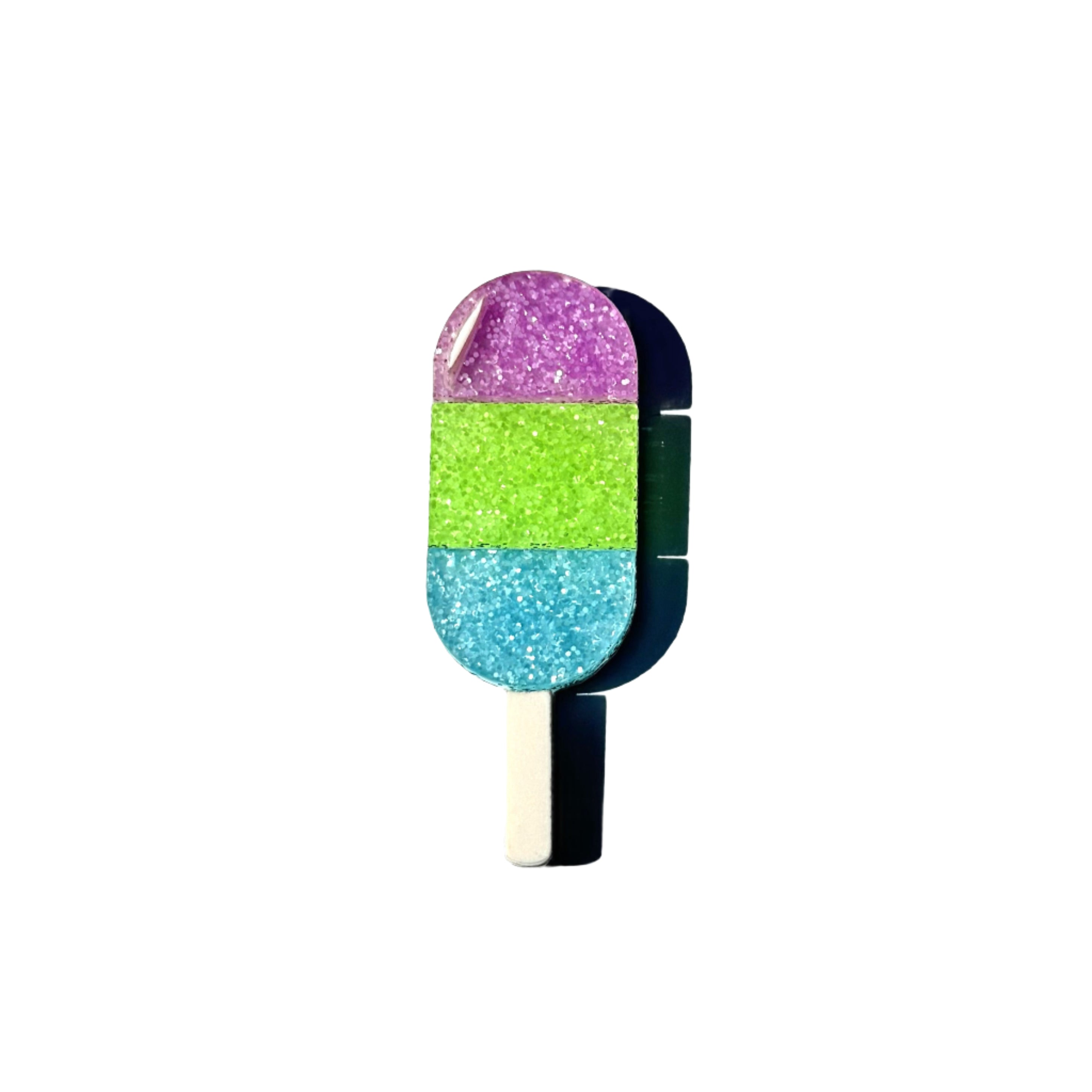 Glitter popsicle pin in purple, green, and blue stripes.