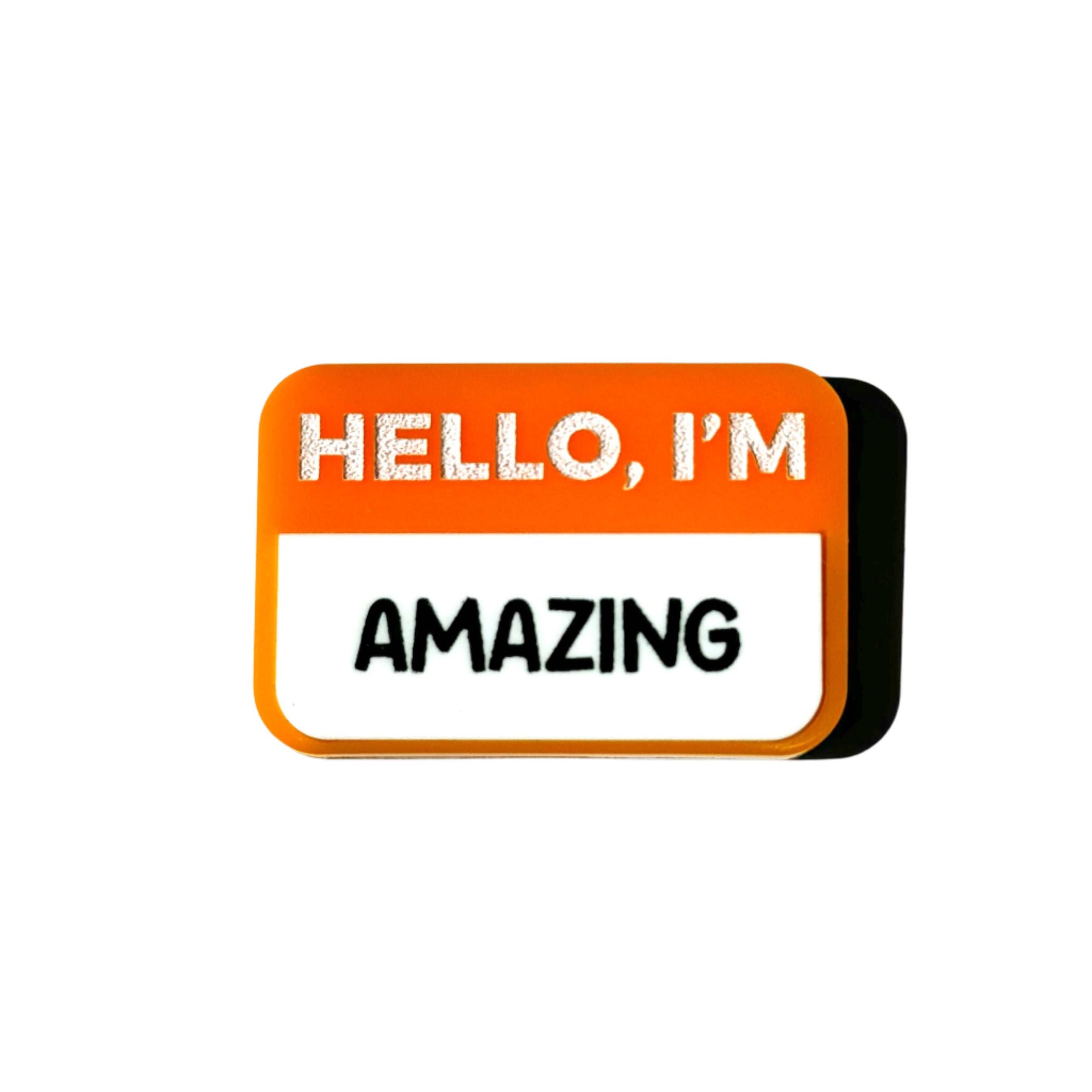 Teal name-tag pin that says “HELLO, I’M AMAZING.”
