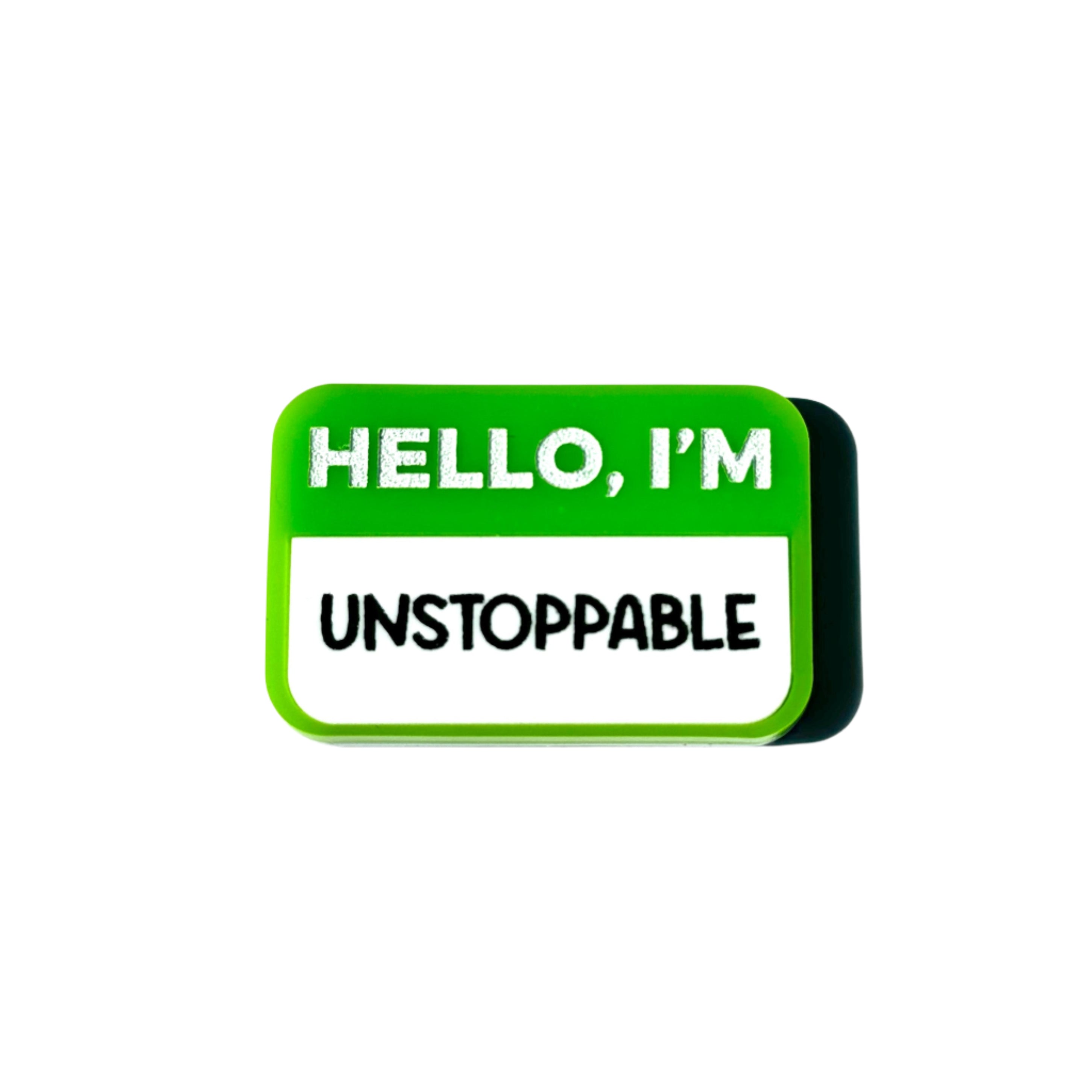 Green name-tag pin that says “HELLO, I’M UNSTOPPABLE.”