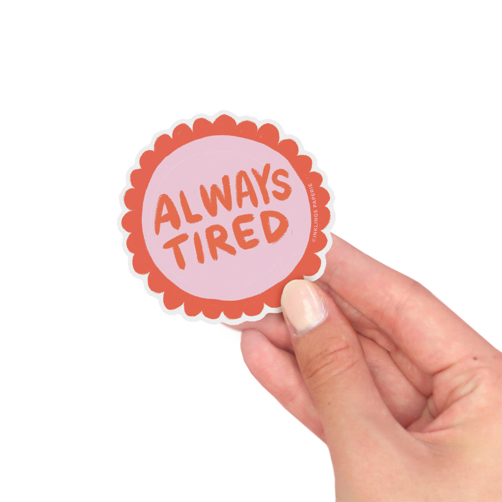 Vinyl sticker that says “Always Tired” in bold red text on a pink and orange design – Funky Confetti