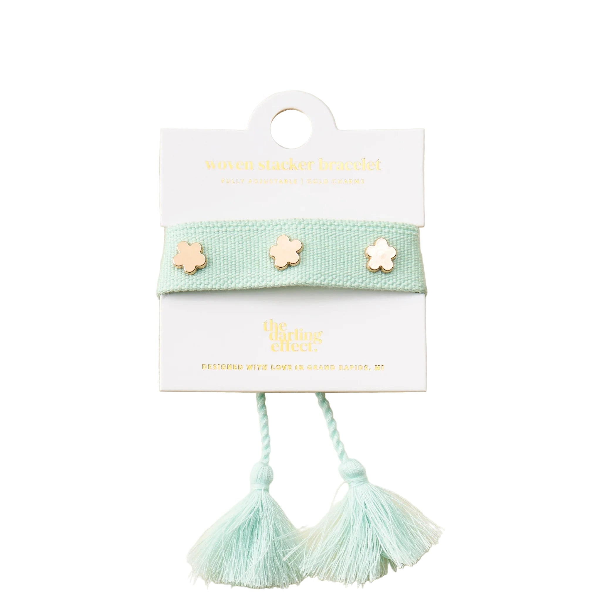 Aqua adjustable woven bracelet with gold flower charms and tassel ends