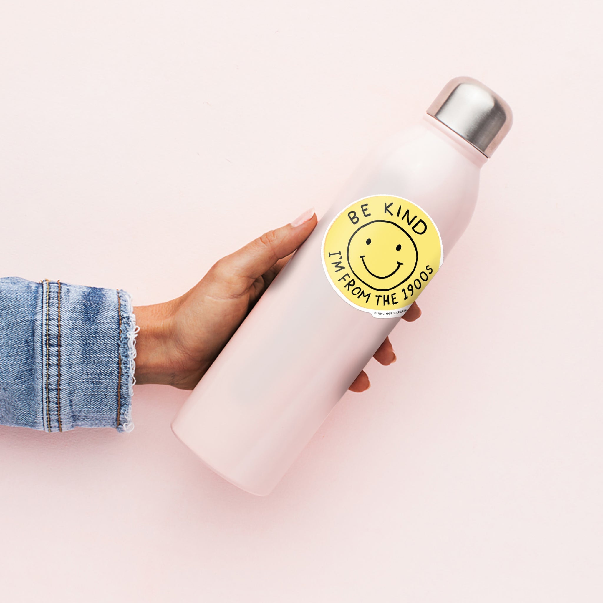 Round yellow vinyl sticker with smiley face that says “Be Kind I’m From the 1900s” – Funky Confetti