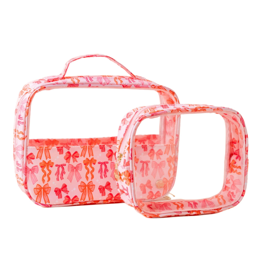 Blushing Bows clear cosmetic bag set with pink and coral bow print – two transparent travel makeup pouches by Funky Confetti