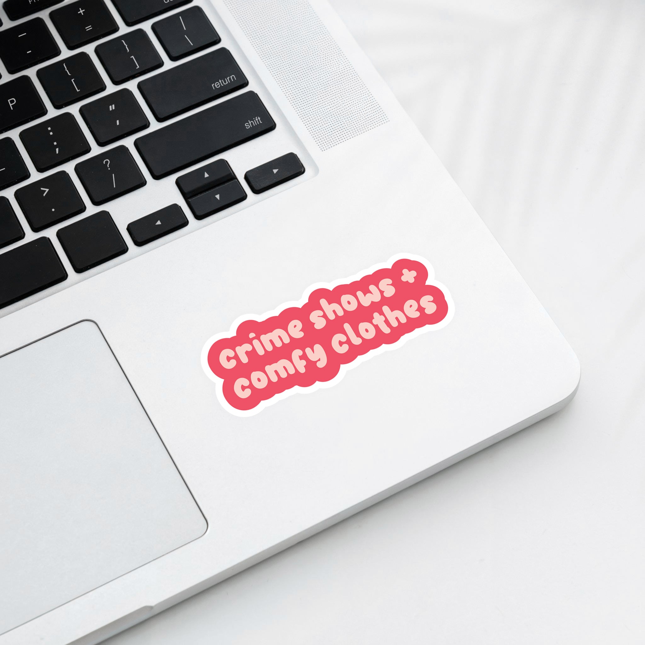 Vinyl sticker with phrase “Crime Shows + Comfy Clothes” in playful pink typography – Funky Confetti