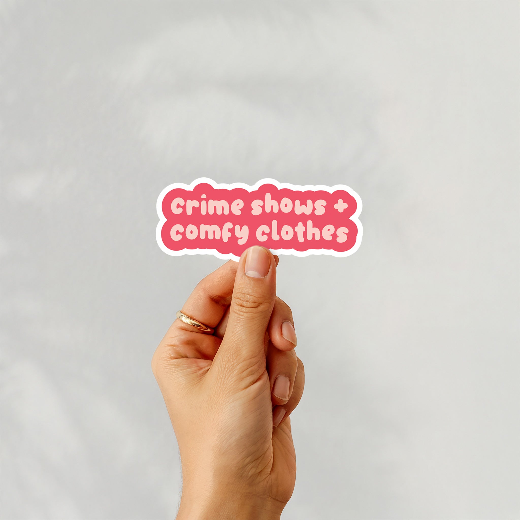 Vinyl sticker with phrase “Crime Shows + Comfy Clothes” in playful pink typography – Funky Confetti