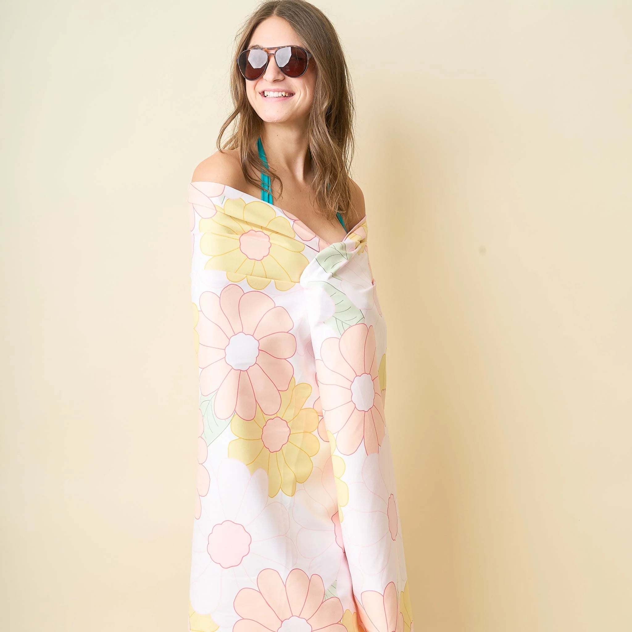 Daisy print XL quick-dry peach beach towel with yellow and pink floral pattern from Funky Confetti
