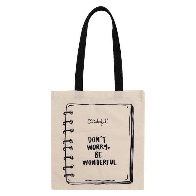 Beige tote bag with black text and handle on a white background