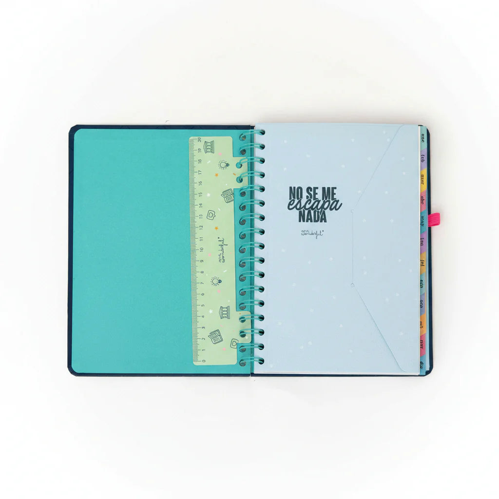 2026 weekly planner with navy cover, pink elastic band, and erasable pen from Funky Confetti