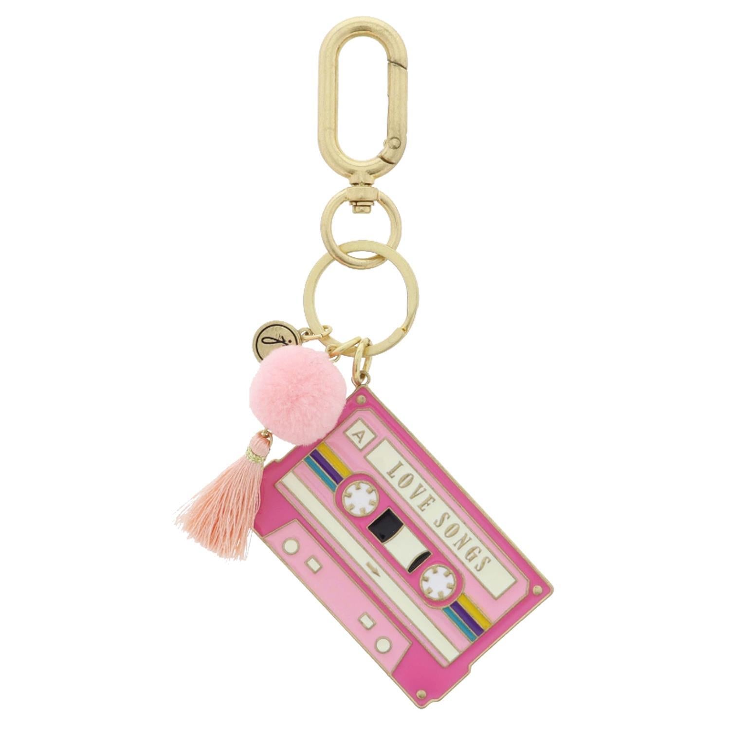 Pink enamel cassette tape keychain with pom-pom and tassel from Funky Confetti