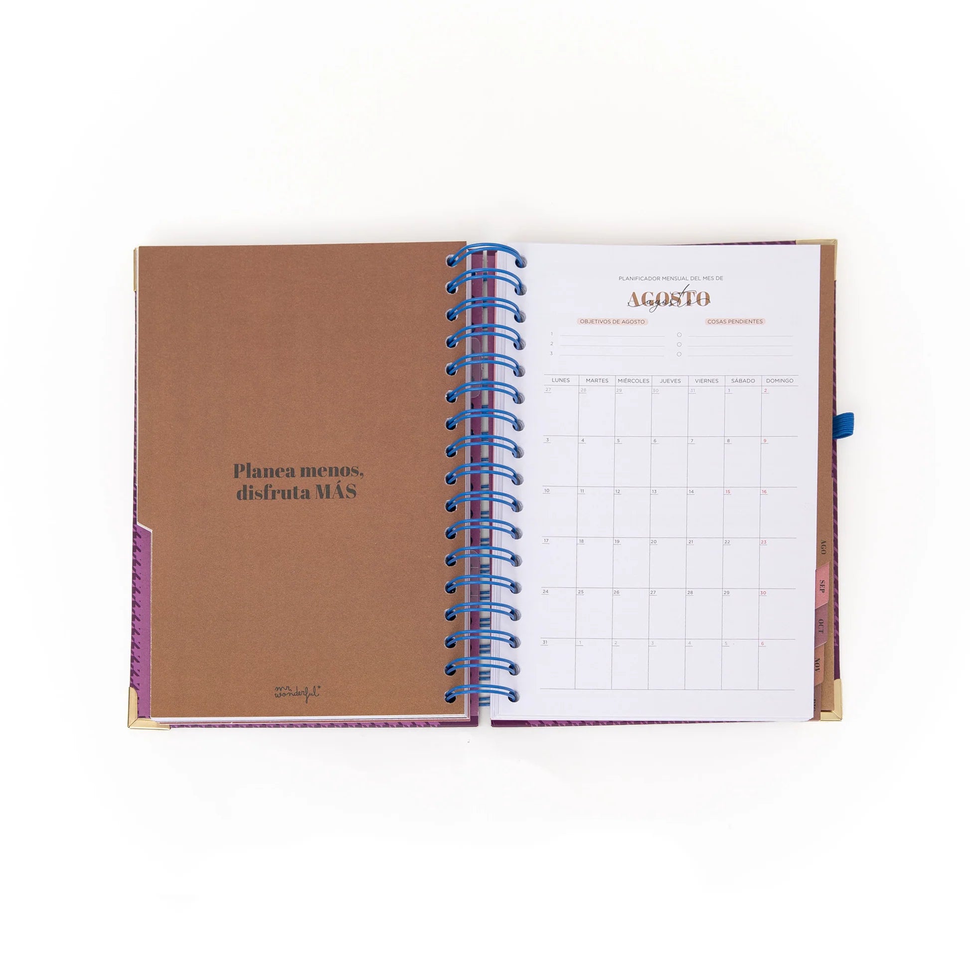 La Vida Es Hoy 2026 daily planner with purple cover, blue elastic band, and matching pen from Funky Confetti