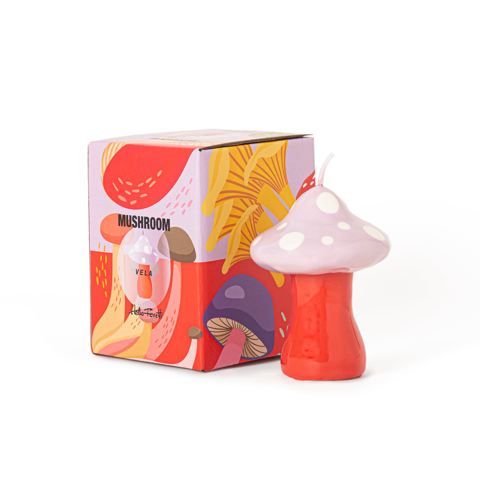 Small pink mushroom-shaped decorative candle with white polka dots and coral stem for whimsical home décor by Funky Confetti.