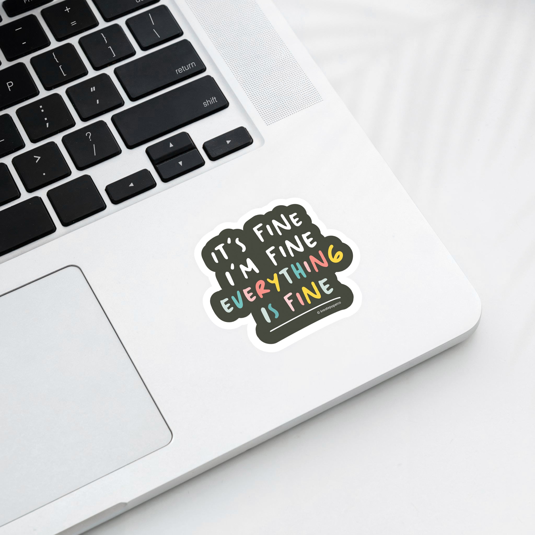 Vinyl sticker with text “It’s Fine, I’m Fine, Everything’s Fine” in colorful typography on black background – Funky Confetti