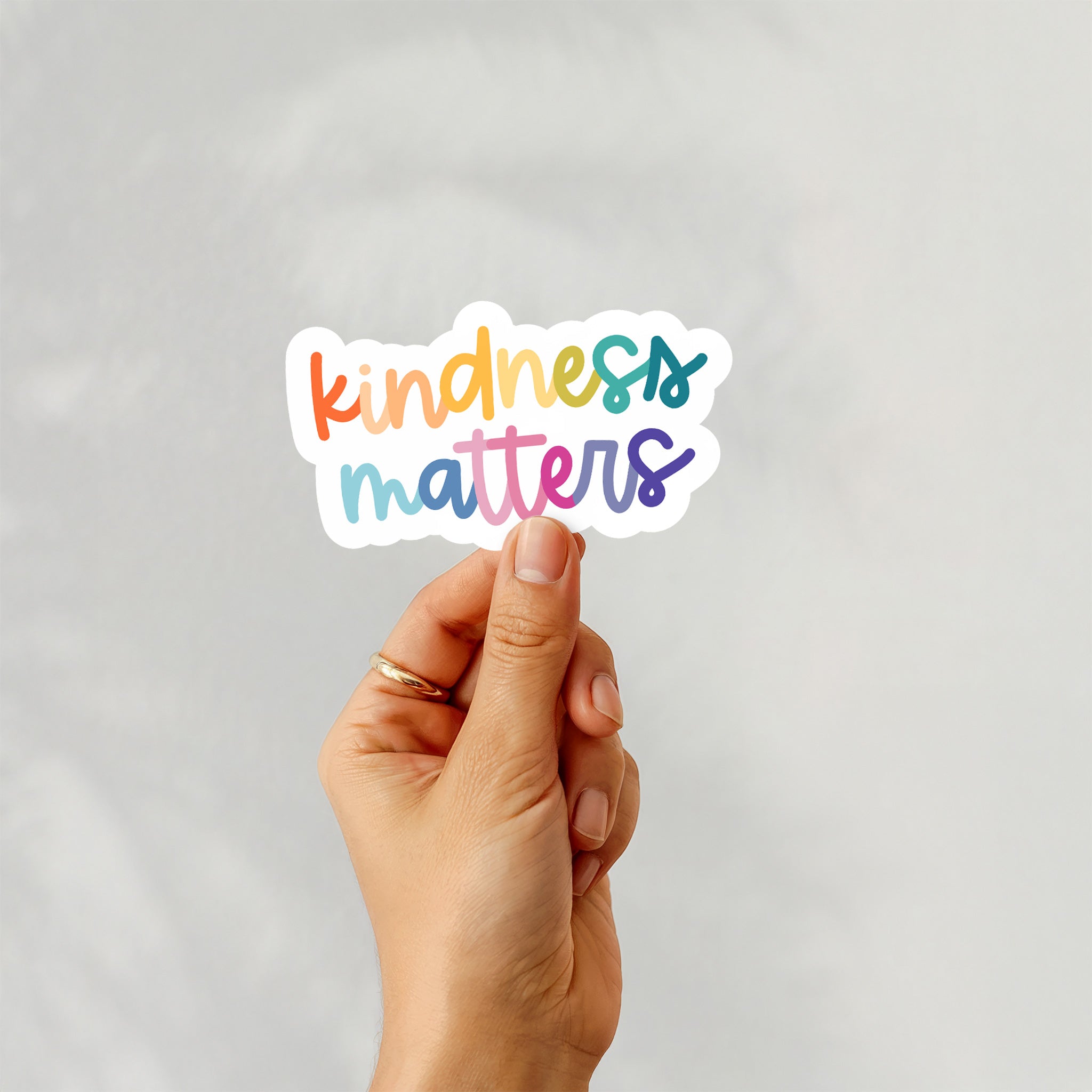 Colorful rainbow vinyl sticker with the phrase “Kindness Matters” in playful multicolor typography – Funky Confetti