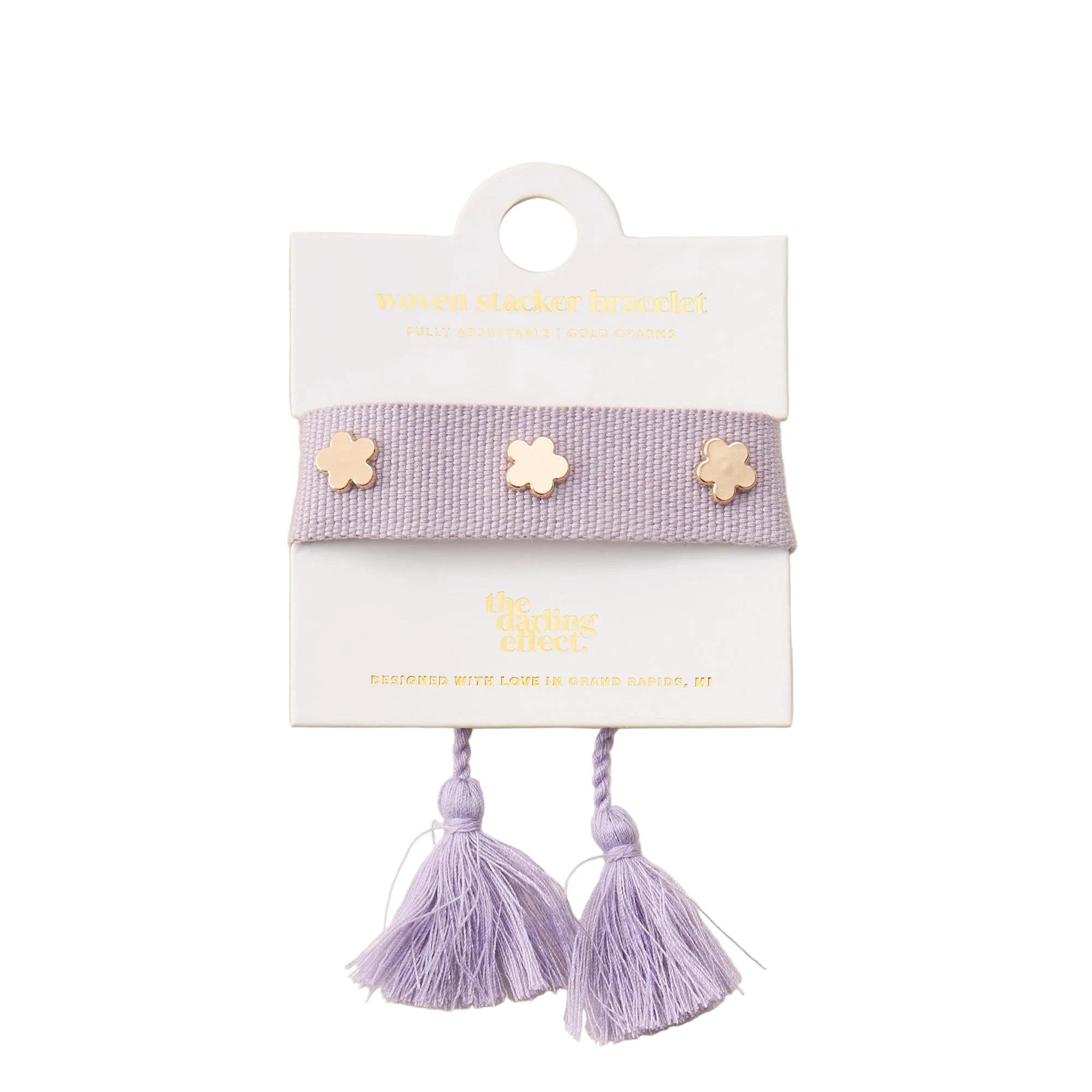 Lilac adjustable woven bracelet with gold flower charms and tassel ends from Funky Confetti