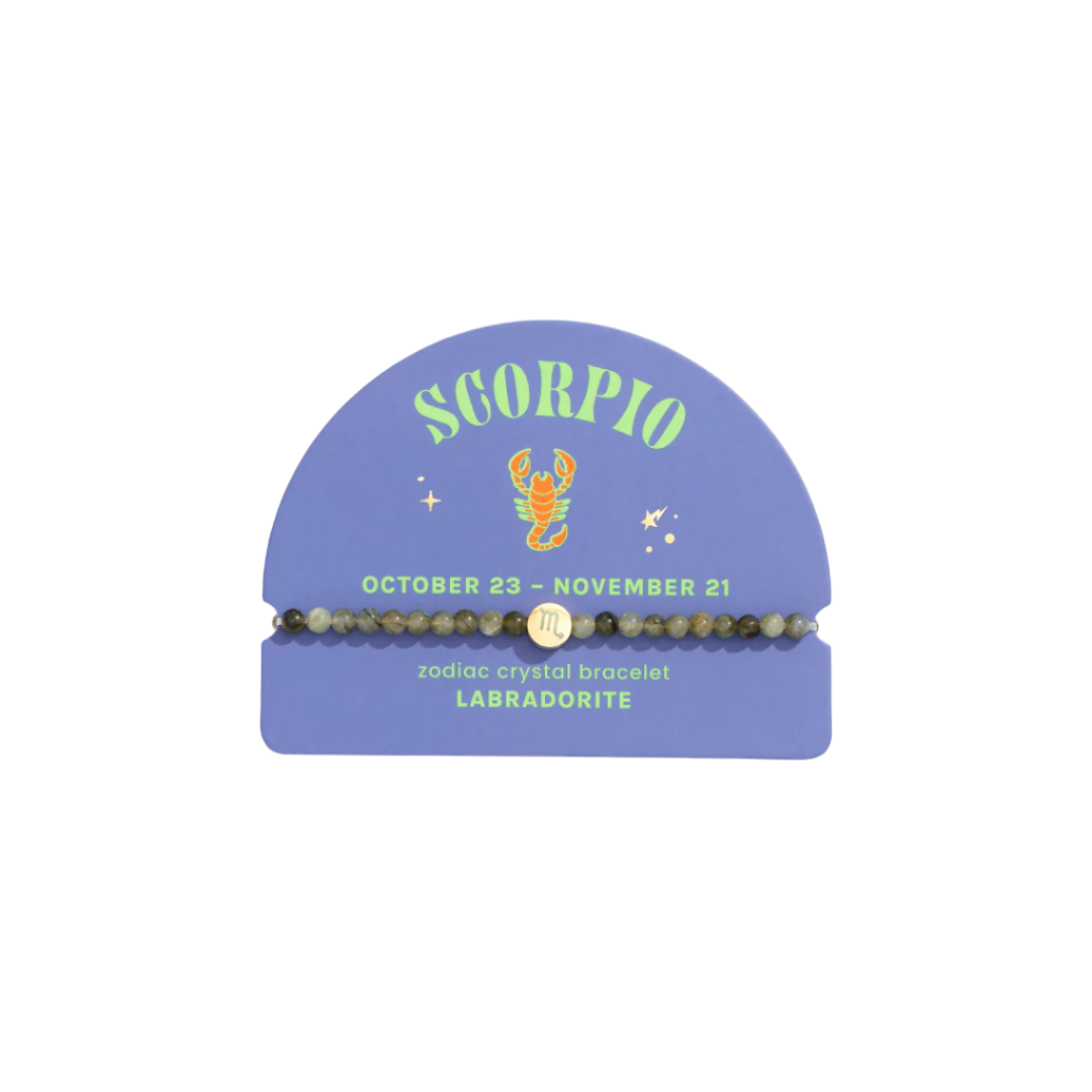 Scorpio zodiac crystal bracelet on a branded card with a scorpion illustration.