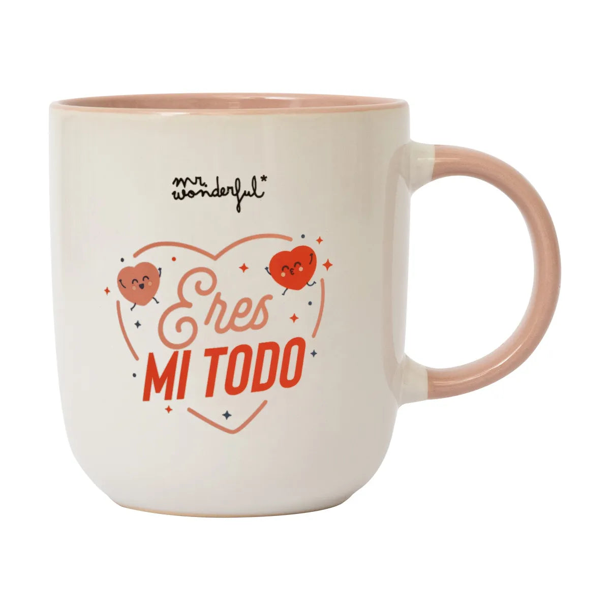Close-up of the “Eres mi todo” ceramic mug — cream exterior, blush handle and interior, heart graphics on the front.