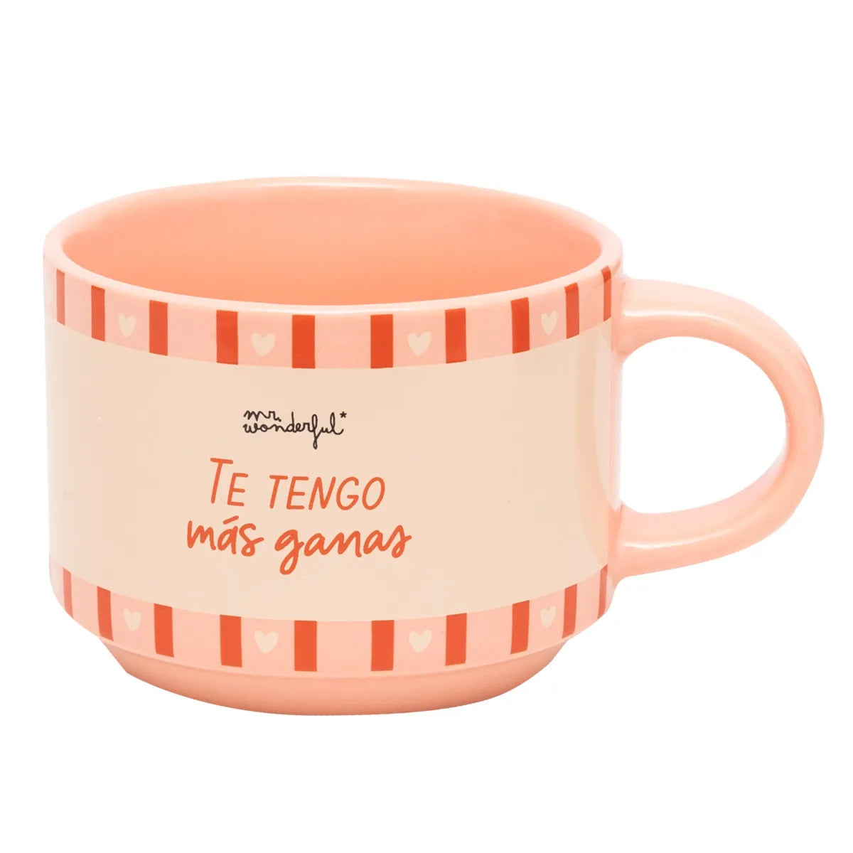 Peach mug with the phrase “Te tengo más ganas” on a cream panel, pink-red striped border.
