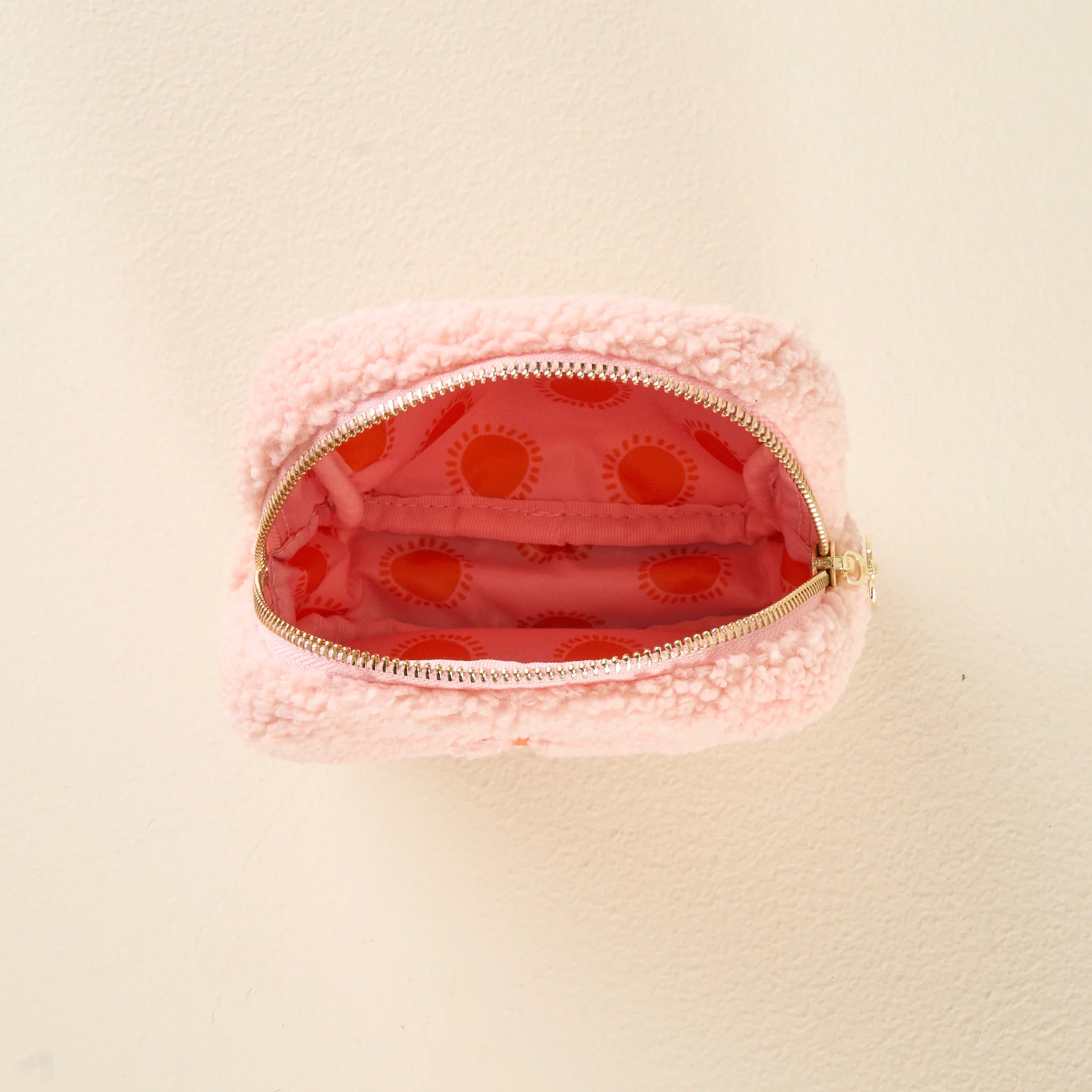 Peach sherpa square teddy pouch with pink palm tree embroidery and gold zipper from Funky Confetti