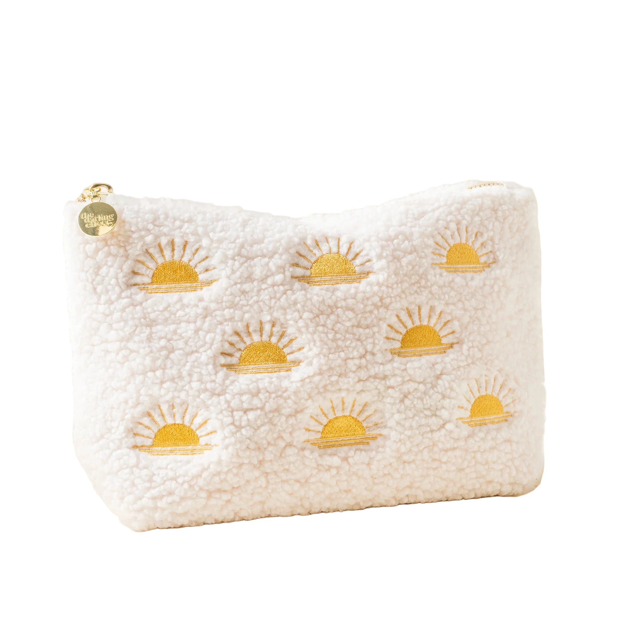 Cream sherpa teddy pouch with embroidered yellow sun pattern and gold zipper from Funky Confetti