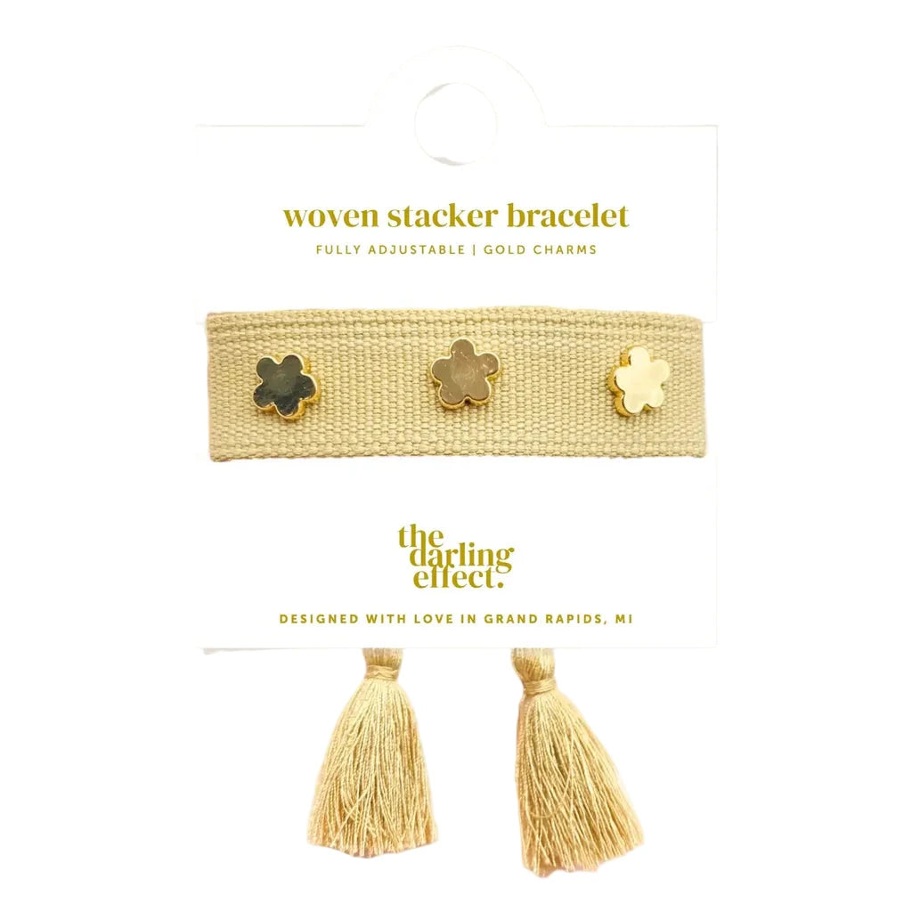Tan adjustable woven bracelet with gold flower charms and tassel ends