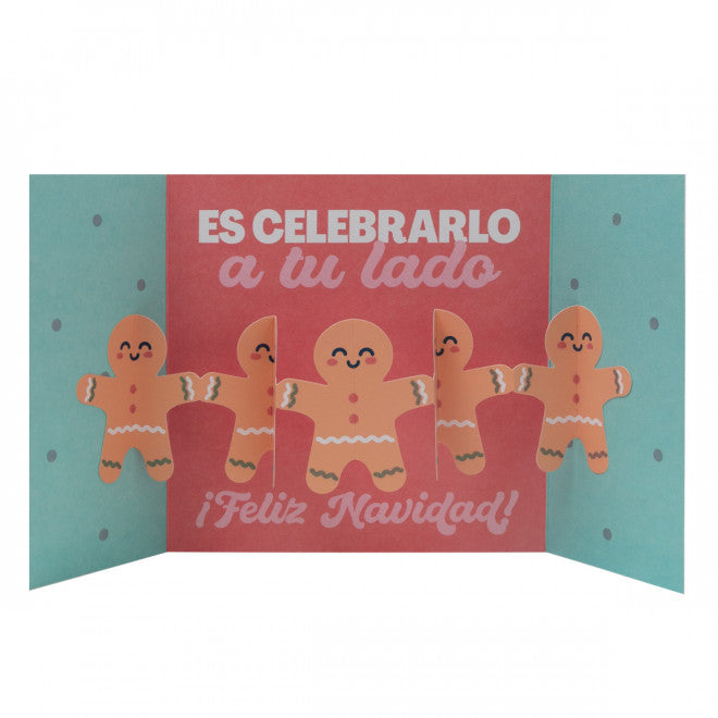 Christmas card with gingerbread characters and teal envelope reading “Lo Mejor de Cada Año”