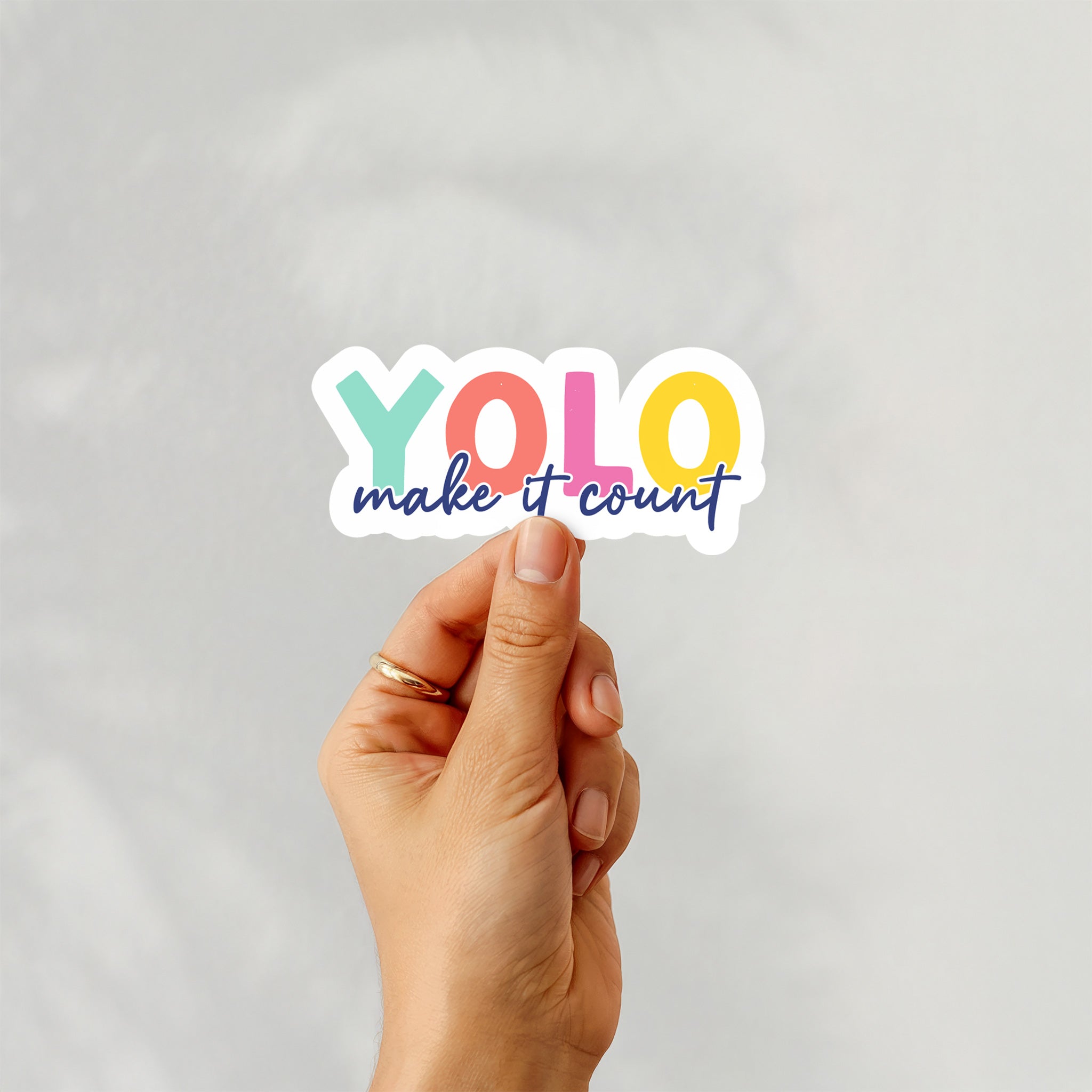 Colorful vinyl sticker with text “YOLO – Make It Count” in bold rainbow colors – Funky Confetti