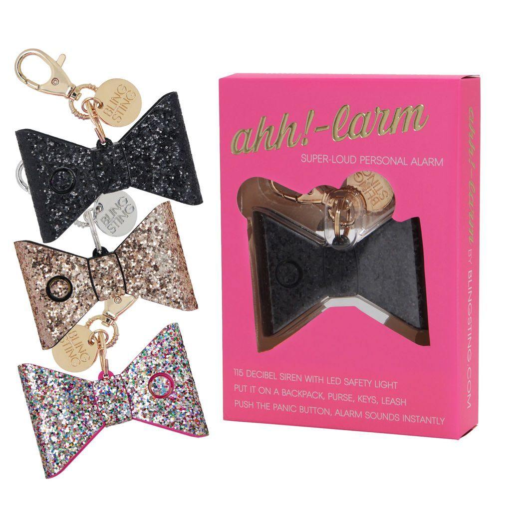 Glitter Bow Alarm with 115 decibel sound, LED safety light, and lobster clip attachment