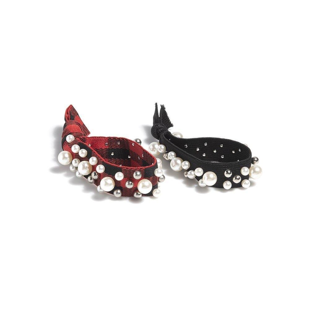 Pearl ponytail holders in red and black with silver and pearl embellishments, showcasing their elegant design.

