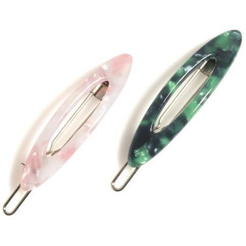 Pearlized hair clips in a set of 2, showcasing their elegant design and vegan material.

