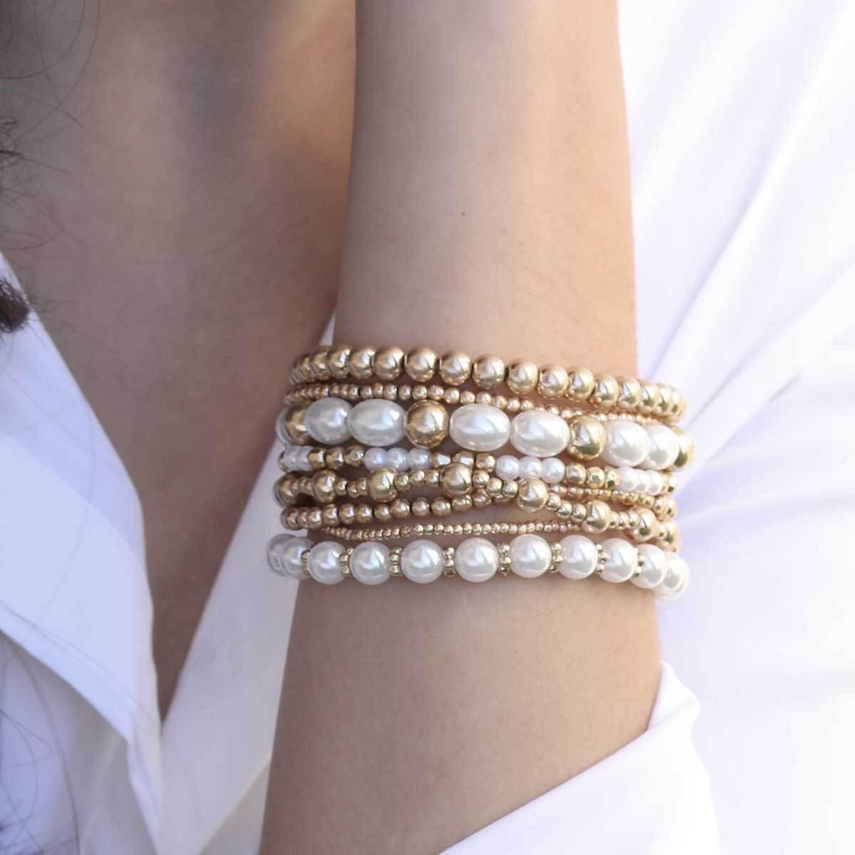 Set of four worn gold layered sphere bead bracelets from Funky Confetti