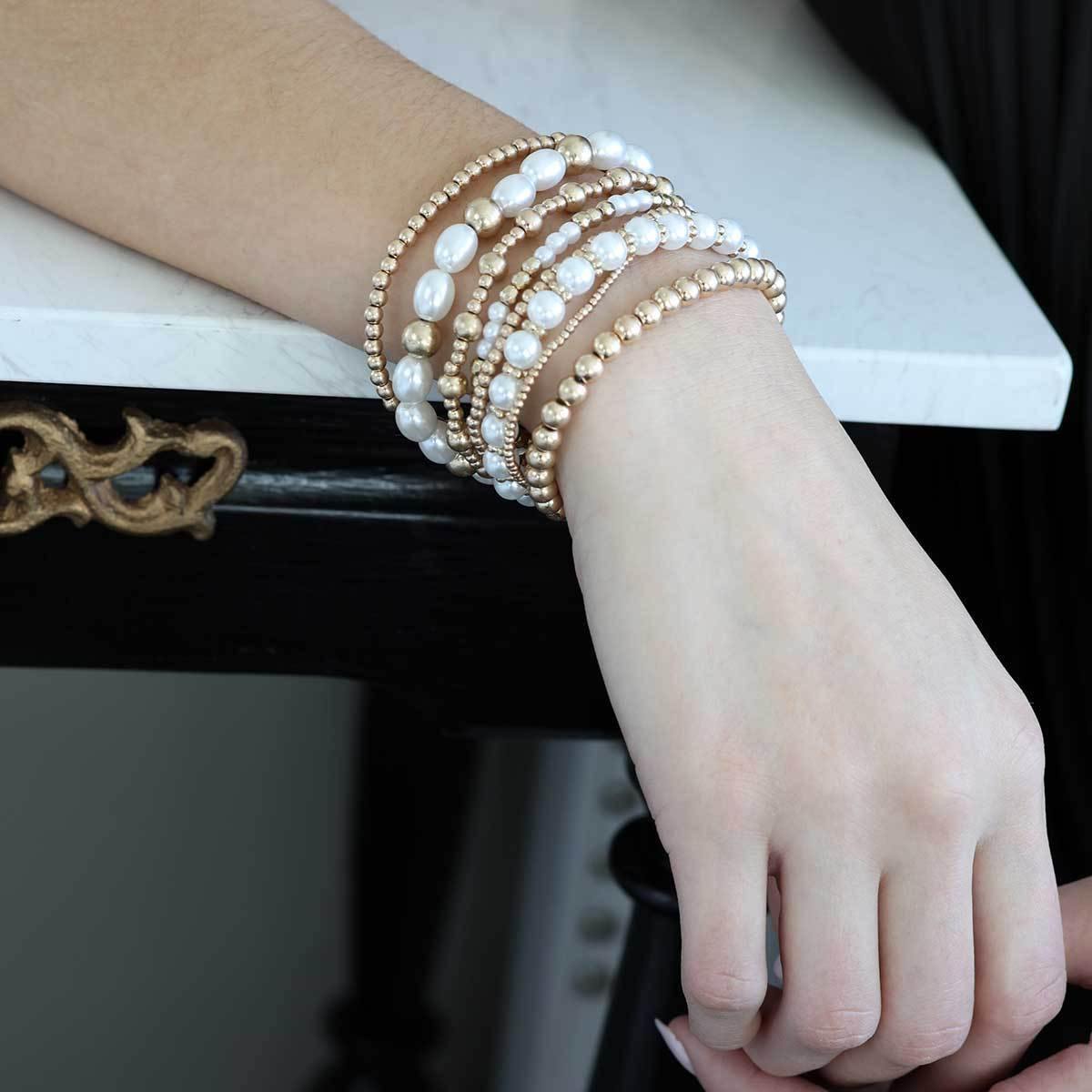 Set of ivory pearl and gold stretch bracelets from Funky Confetti