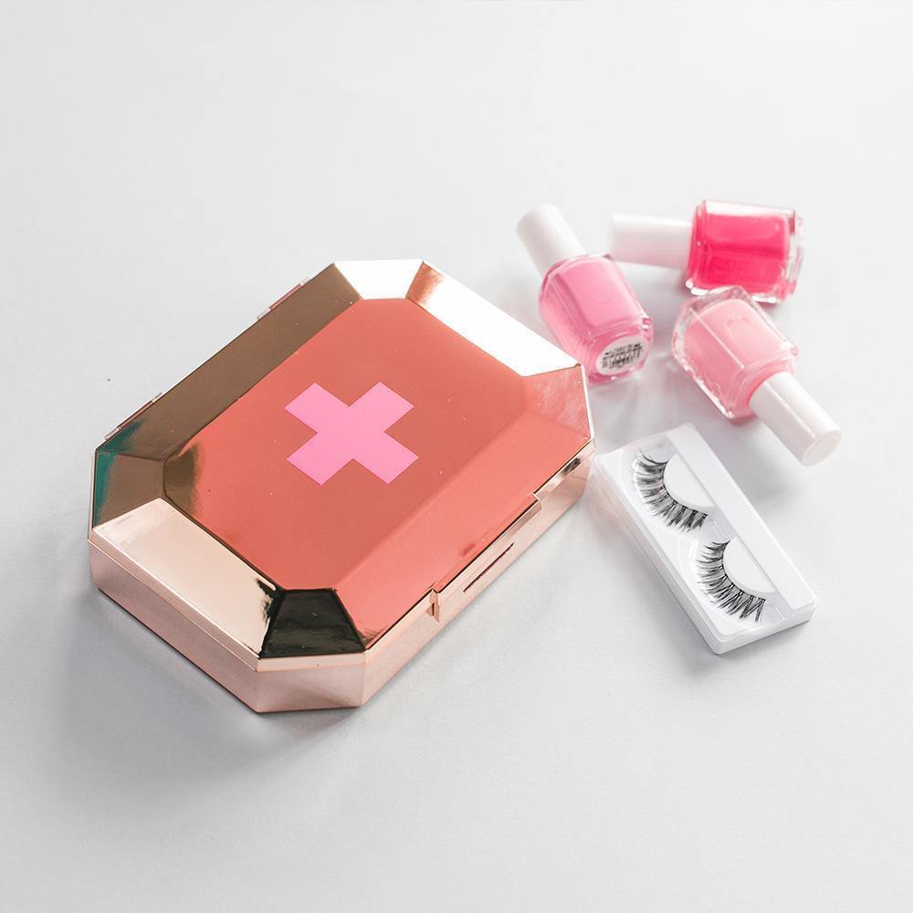 Metallic gemstone-shaped first-aid kit clutch with 75 emergency supplies from Funky Confetti